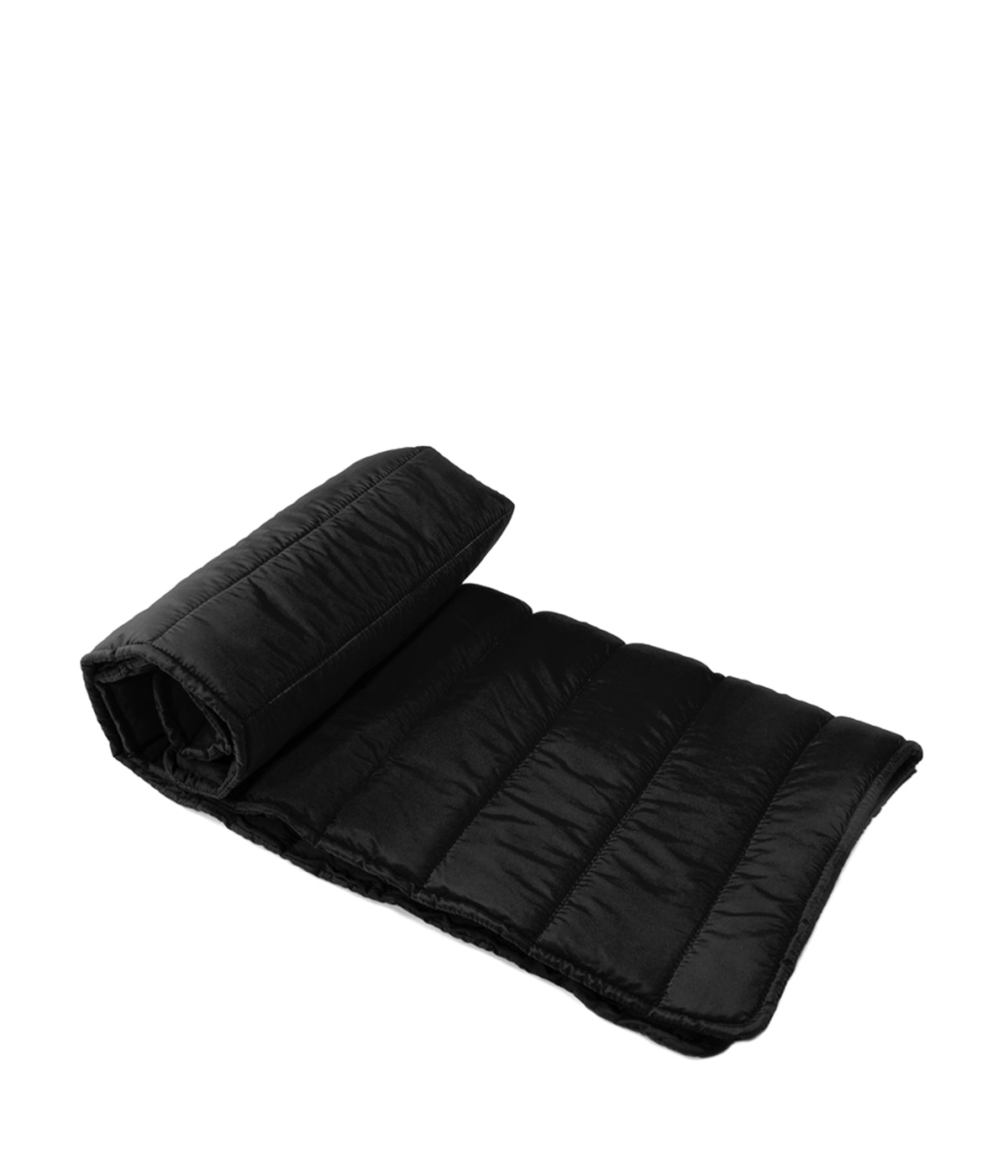 Una cama para perros medio enrollada en color negro