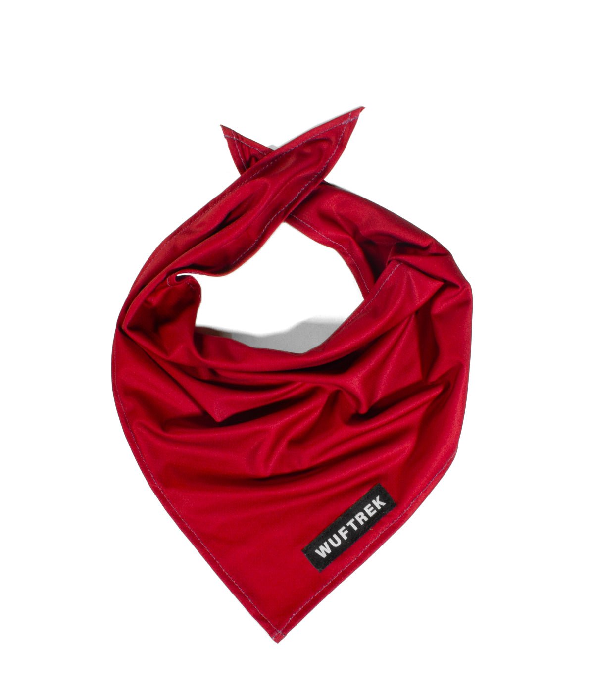 Una pañoleta para perros hecha en tela deportiva microperforada en color rojo