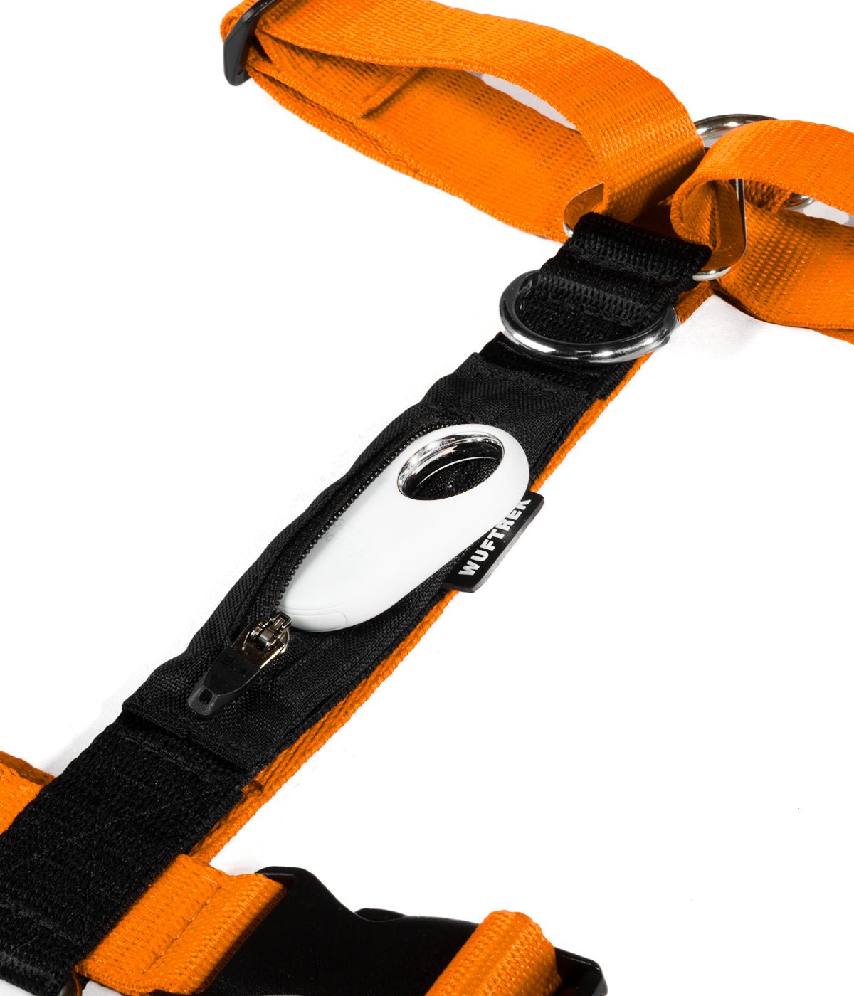 Samsung SmartTag partially inserted into the tracker pocket of an orange and black TrekZero H-Series dog harness