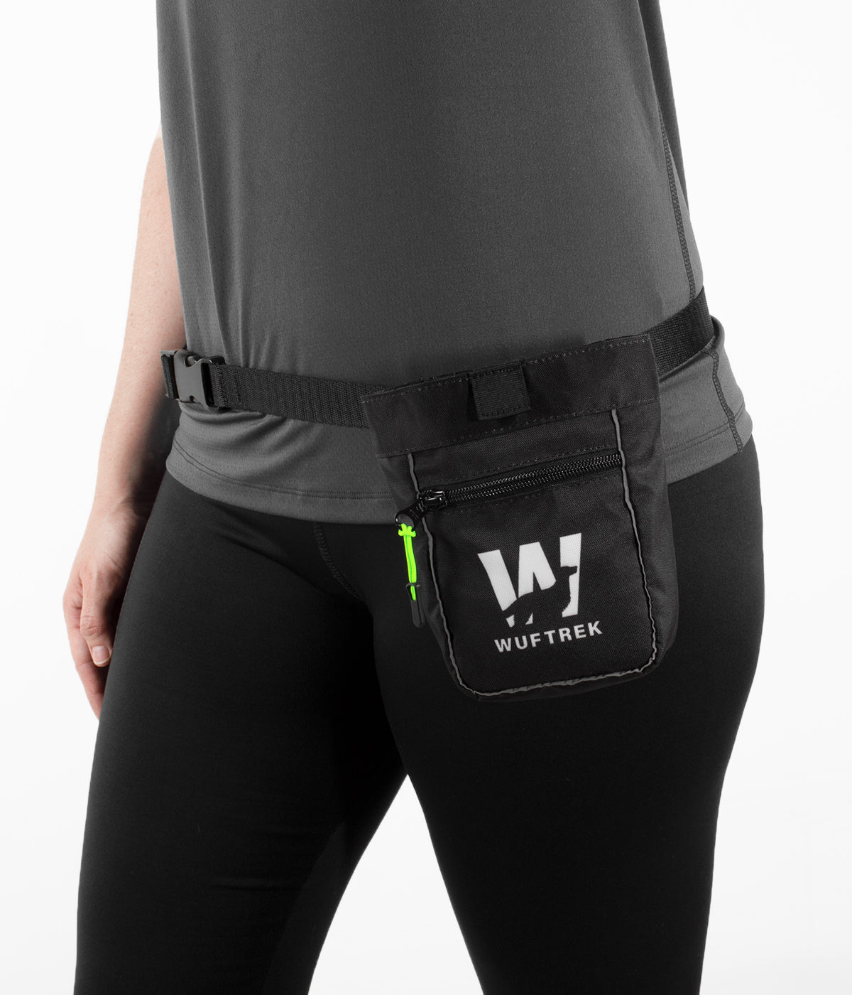 Woman wearing a black dog treat pouch