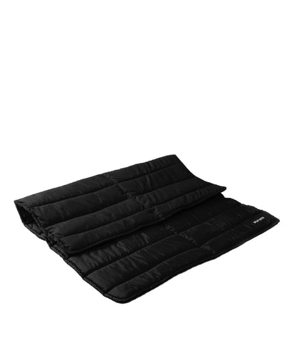 Una cama para perros en color negro