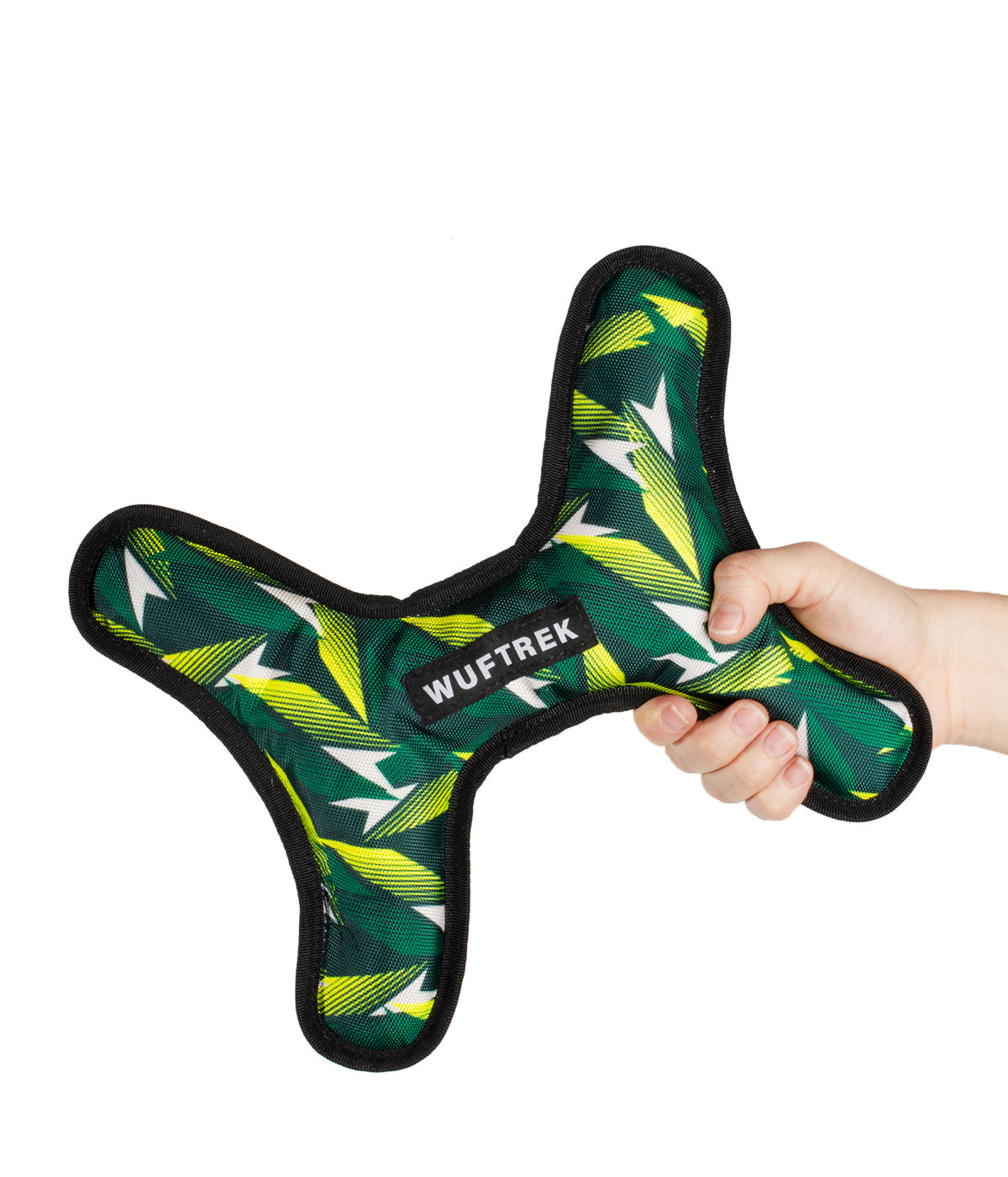 Woman holding a large bone-shaped dog toy in green and yellow