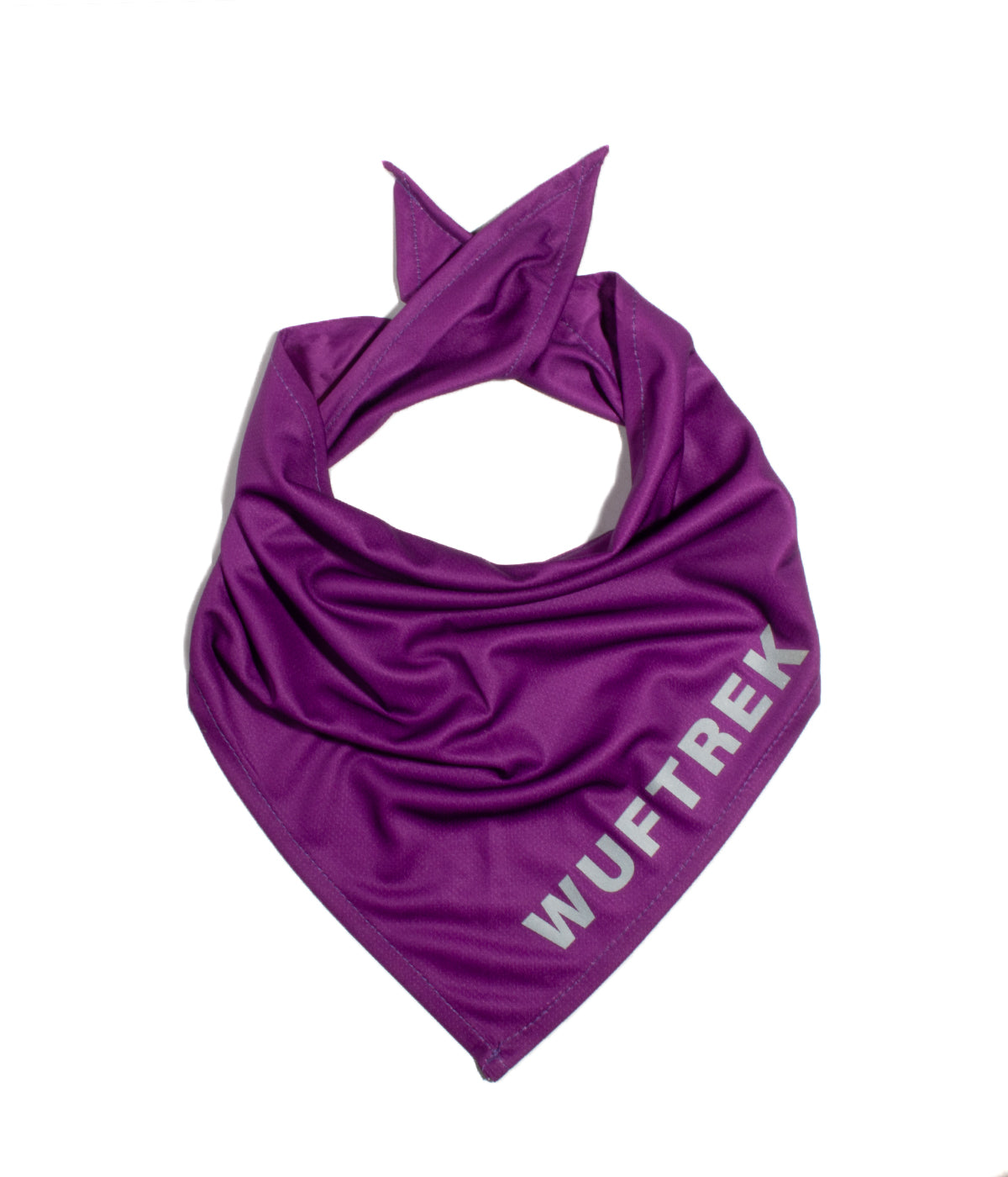 Violet fabric dog bandana with WUFTREK branding on one edge